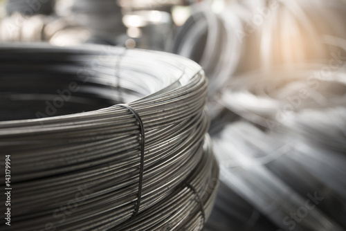 Stainless Steel wire Rolls in construction site. Close up of Metal Steel reinforced rod for concrete in warehouse store. Construction Concept