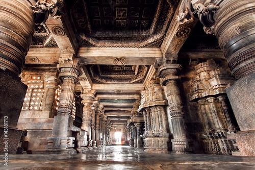 Ancient columns and corridor inside the 12th century stone temple Hoysaleswara, India. Temple was built in 1150 by king of Hoysala Empire, now Karnataka state