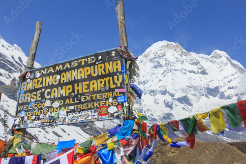 ANNAPURNA, NEPAL – APRIL 14, 2016 : Himalaya Annapurna South mountain peak with Annapurna base camp sign, there is very famous trekking destination in Nepal.