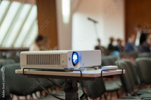 Projector demonstrates the presentation at the conference