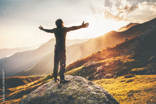 Happy Man raised hands at sunset mountains Travel Lifestyle emotional concept adventure summer vacations outdoor hiking mountaineering harmony with nature
