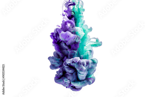 colorful ink isolated on white background. purple blue drop swirling under water. Cloud of ink in water. 