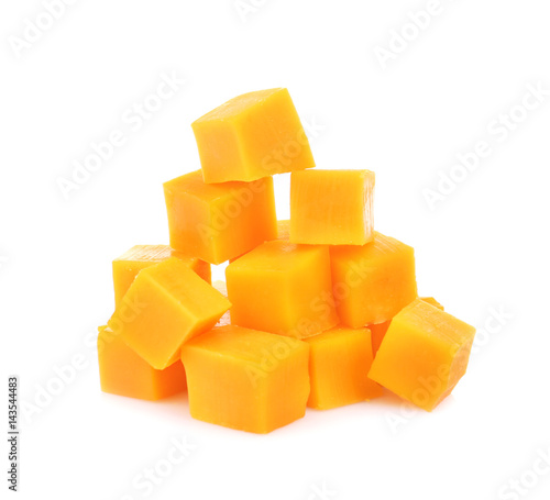 Delicious pieces of cheddar on white background