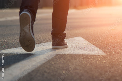 Female walk in blue Sneakers And Arrow