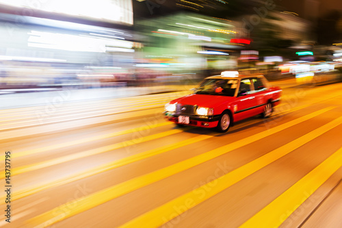 taxi in Hong Kong in motion blur at night