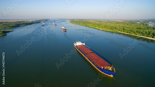 Caravan of barges on the river