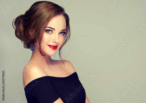Beautiful model girl with elegant hairstyle . Woman with fashion style makeup 