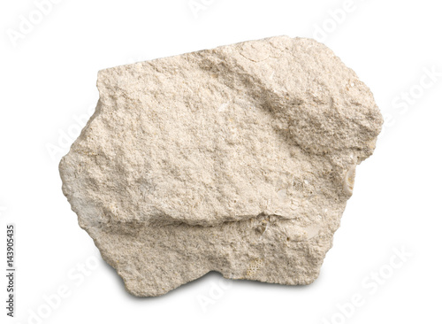 Limestone isolated on white background. Limestone is a sedimentary rock composed of skeletal fragments of marine organisms.