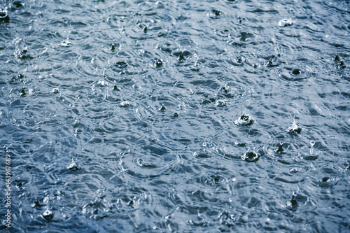 Heavy rain drops on a lake