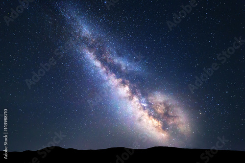 Milky Way. Colorful night landscape with bright milky way, starry sky and hills in summer. Space background. Amazing astrophotography. Beautiful universe. Travel
