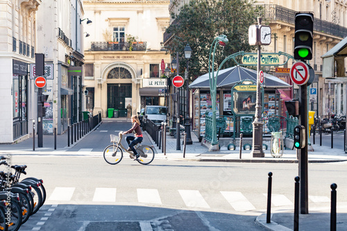 Woman riding a Velib bicycle in Paris