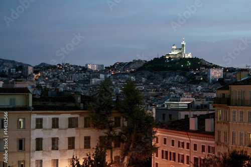 Typical view of Notre Dame de la Garde basilica in Marseille, France, from Saint Charles district at dusk.