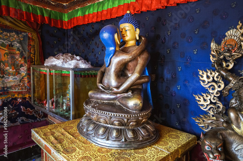 Statue of the Buddha Samantabhadra in the union with Samantabkhadri in a kama sutra pose in a tibetan temple. It is a symbol of indissoluble unity of pleasure and emptiness.