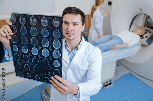 Handsome male oncologist working in the medical lab