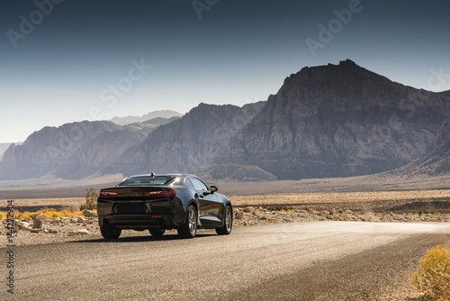 Black Sports Car on a Desert Road