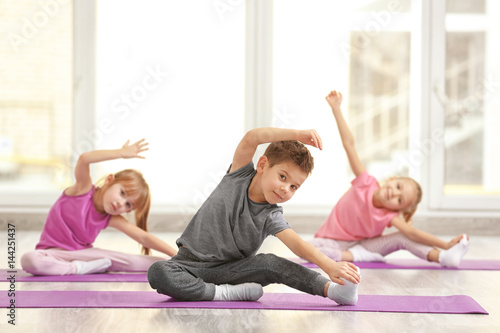 Group of children doing gymnastic exercises