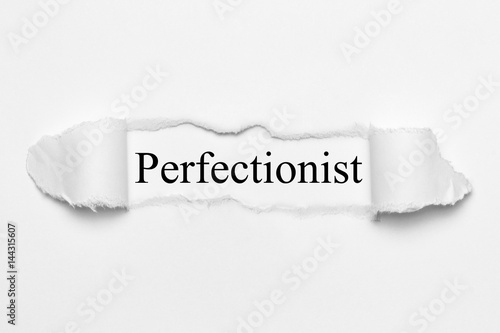 Perfectionist on white torn paper