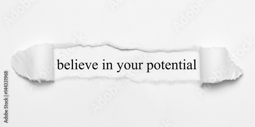 believe in your potential on white torn paper