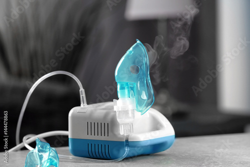 Compressor nebulizer with mask on table