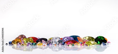 Colorful of different gemstones with space for text on white background.