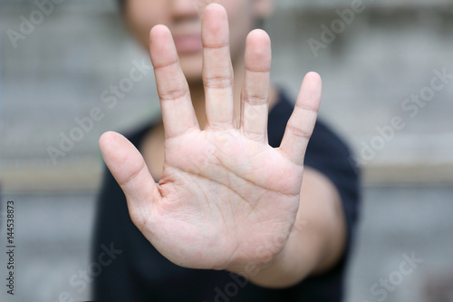 hand with stop gesture