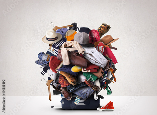 Big heap of different clothes and shoes