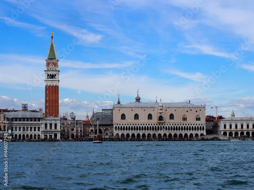 Venice san marco palace from the sea with clouds and blue sky