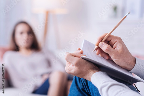 Selective focus of a pencil being used for writing