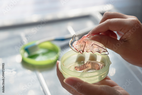 Retainer in woman hand