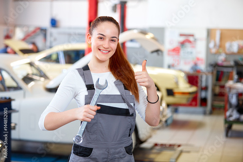 Female mechanic in car service station