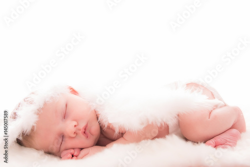 Infant baby with angel wings on neutral background