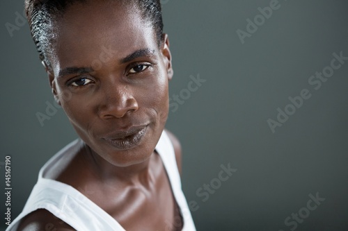 Androgynous man looking at camera