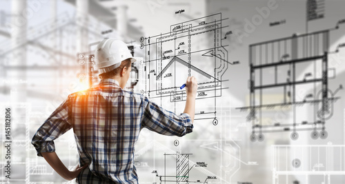 Engineer woman draw layout . Mixed media