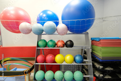 Balls on a stand in a fitness hall
