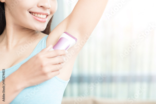 woman with armpit plucking