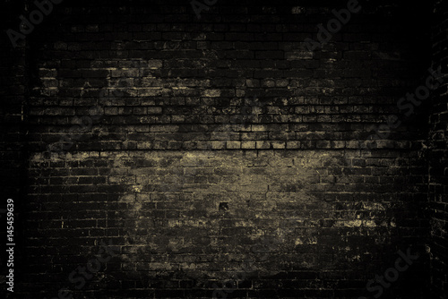 Old brick wall, dark light. Grunge background