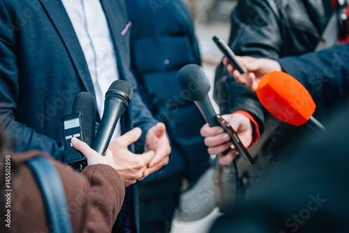 Interviewing businessman on press conference