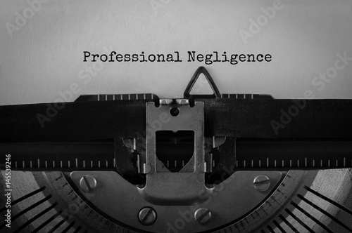 Text Professional Negligence typed on retro typewriter