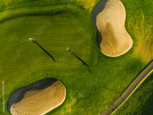 Aerial view of golfers on putting green