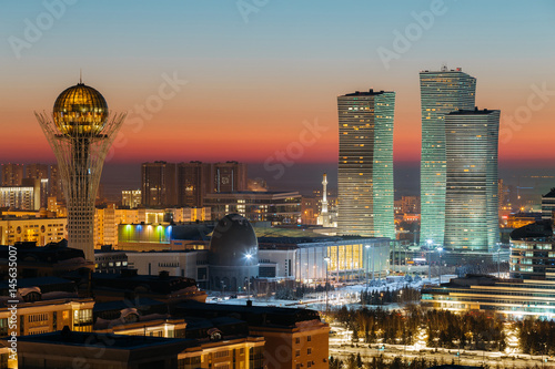 Top view of the Baiterek Monument and the Northern Lights complex on the evening of a winter sunset day in Astana, Kazakhstan