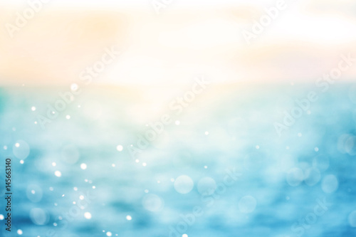 Blur beautiful shiny sparkling tropical blue sea beach , the fresh summer background .