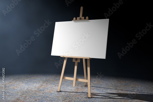 Wooden Artist Easel with White Mock Up Canvas in the volumetric light. 3d Rendering