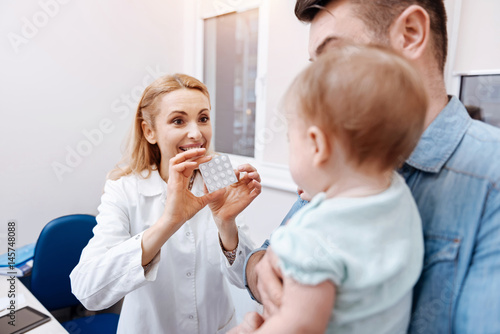 Back side of little patient while looking at nurse