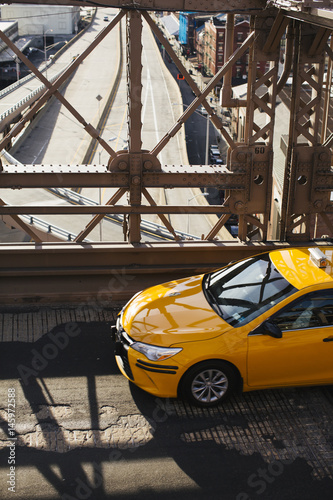New york taxi crossing a bridge