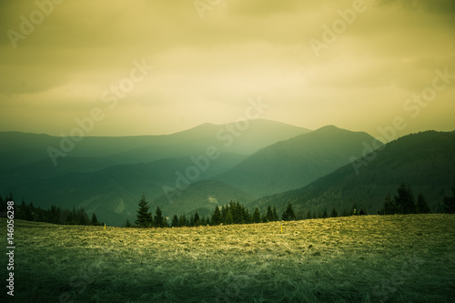 A beautiful hillside scenery of Tatra mountains. Warm summer haze, colorful contrast look.