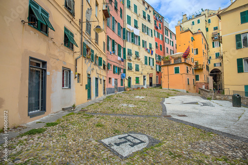 GENOA (GENOVA) ITALY. APRIL 14, 2017 - View of a part of old city called "Campo Pisano", a square with colorful houses in Genoa, Italy