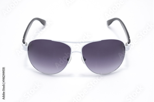 Sunglasses with purple glass in an iron frame isolated on white