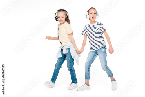 Kids in headphone listening music