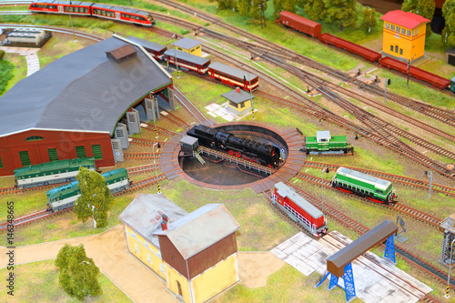 Miniature railway train station model with railway depot and trains. Handmade railways model.