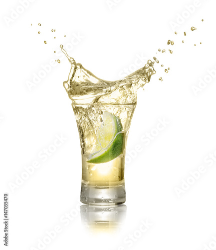 shot of gold tequila with splash